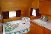 Full sized bed in vintage 1956 Shasta travel trailer